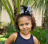 Girls boutique animal print hair bow with feather center.