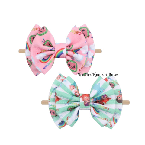 6 inch Bullet Liverpool Cocomelon Bows on nylon headbands, perfect for Cocomelon fans. You choose between a Pink Cocomelon headband and a Mint Cocomelon Headband. 