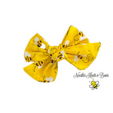 Bee print fabric hair bow or nylon headband.  Bee's on Yellow fabric bow