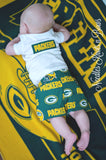 I applique the team name onto the back of boys onesies / shirts.