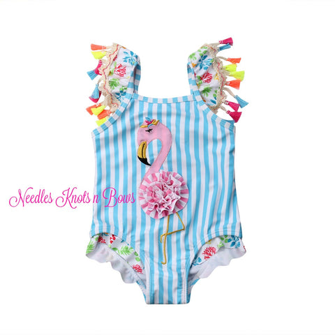 Darling boutique style girls flamingo swimsuit. One piece with trim with a fabric flower as the flamingos body making this suit a "Keeper".  There is a ruffle around the leg openings as well.