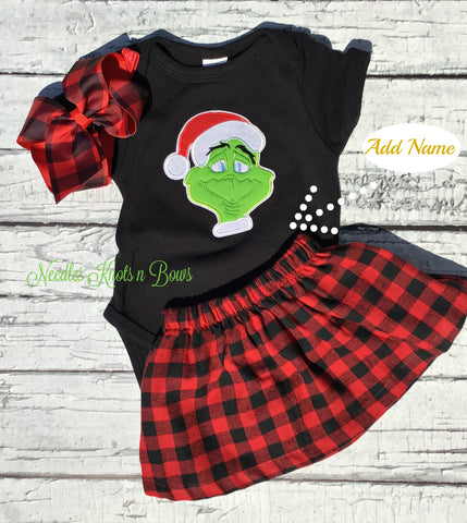 Girls Christmas Grinch Outfit. Buffalo plaid skirt with a black onesie or shirt with the Grinch on the front of it.