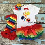 Sesame Street First Birthday Outfit Girl.  Rainbow ruffled bloomers paired with a darling first birthday onesie and you choose to add on the matching heafband and or rainbow striped leg warmers.