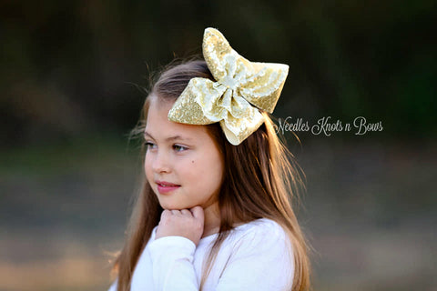 girls 8" gold sequin hair bow.