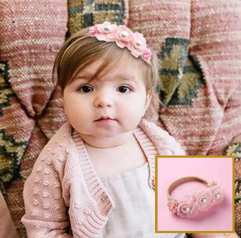 Baby girls pink floral nylon headband with pearl embellishments. 