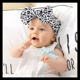Baby girls turban headband in a mini cow print