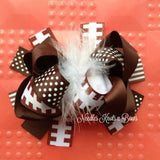 Girls layered boutique over the top football hair bow. 