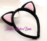 Black and pink plush cat ear headband.
