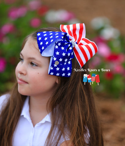 Girls red, white and blue hair bow. 7 inch American Flag hair bow perfect for any and all occasions U.S.A.  Stars & Stripes with a diamond embellished center for an extra sparkle. 
