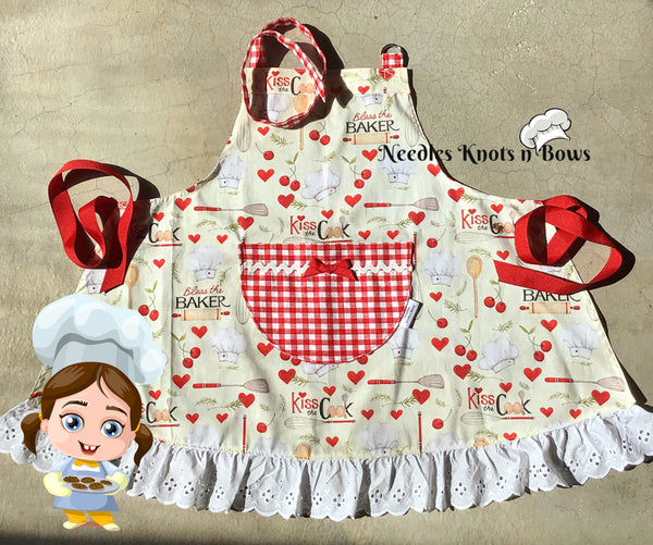 Beautiful funny girl daughter kid in aprons kitchen cooking in the kitchen  cookies and pasta noodles and cakes Stock Photo by ©marcink3333 169353722