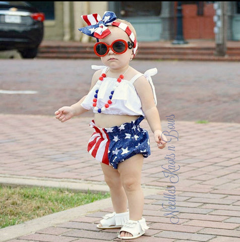 Girls 4th of July Outfit. Stars & stripes bloomers paired with a white flounce top and matching headwrap make for a darling Patriotic outfit perfect for all things USA!  Available in sizes from Newborn upto a size 6
