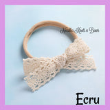Ecru lace trim bow headband for baby girls and toddlers..  This headband is a great choice for adding to your little one's bow collection or getting it started. 