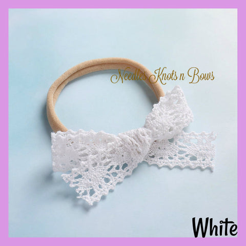 White crochet lace bow headband.