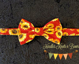 Sunflowers on a small polka dot rust colored background bow tie.